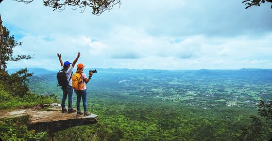 Travelers enjoying a panoramic mountain view